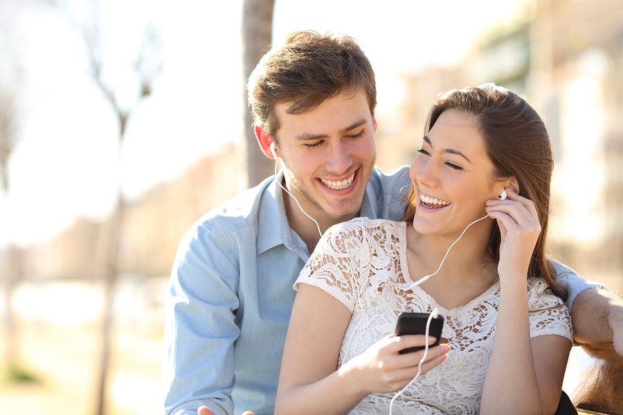 Couple Listening To The Music From A Smart Phone