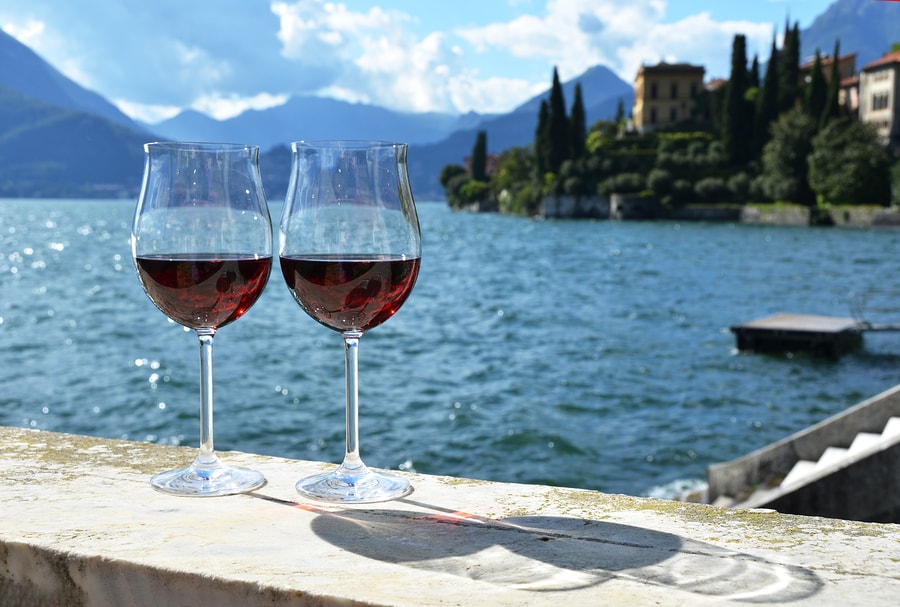 Two wineglasses. Varenna town at the lake Como, Italy